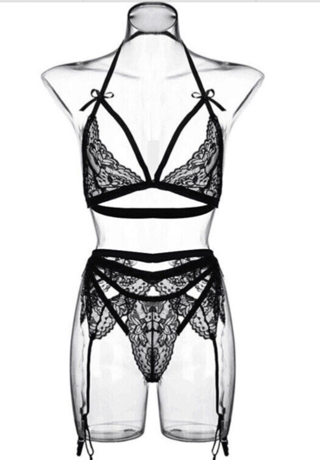Black lace lingerie set on a mannequin against a white background