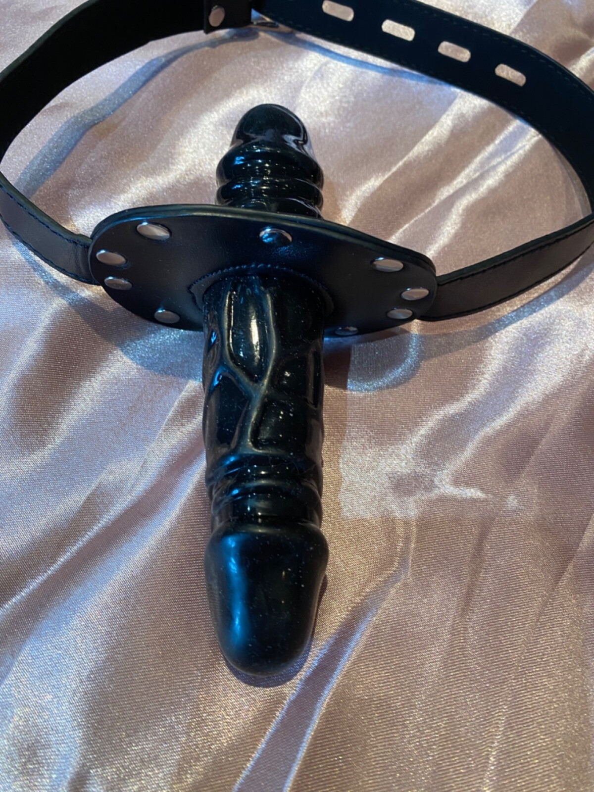 Black metal object on a textured beige surface