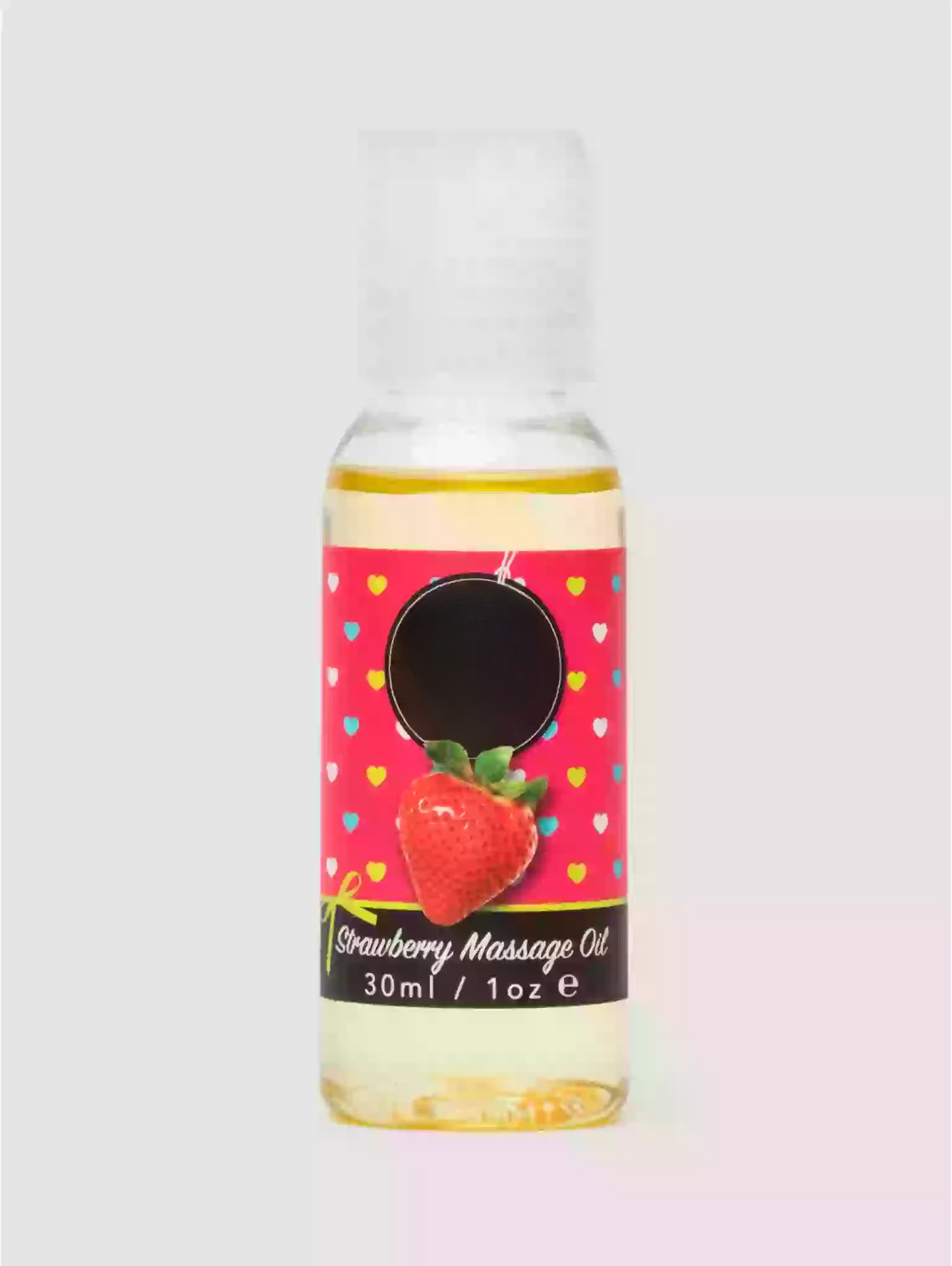 Bottle of strawberry massage oil with a colorful label on a light pink background