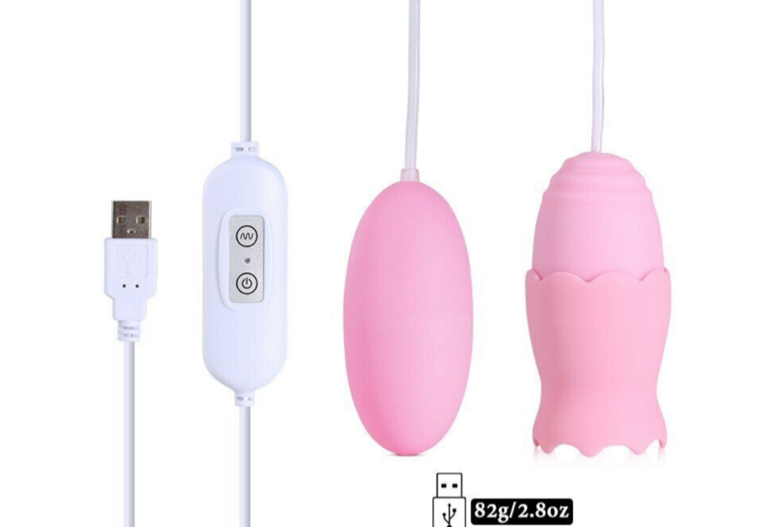 Pink silicone device with USB cable on a white background