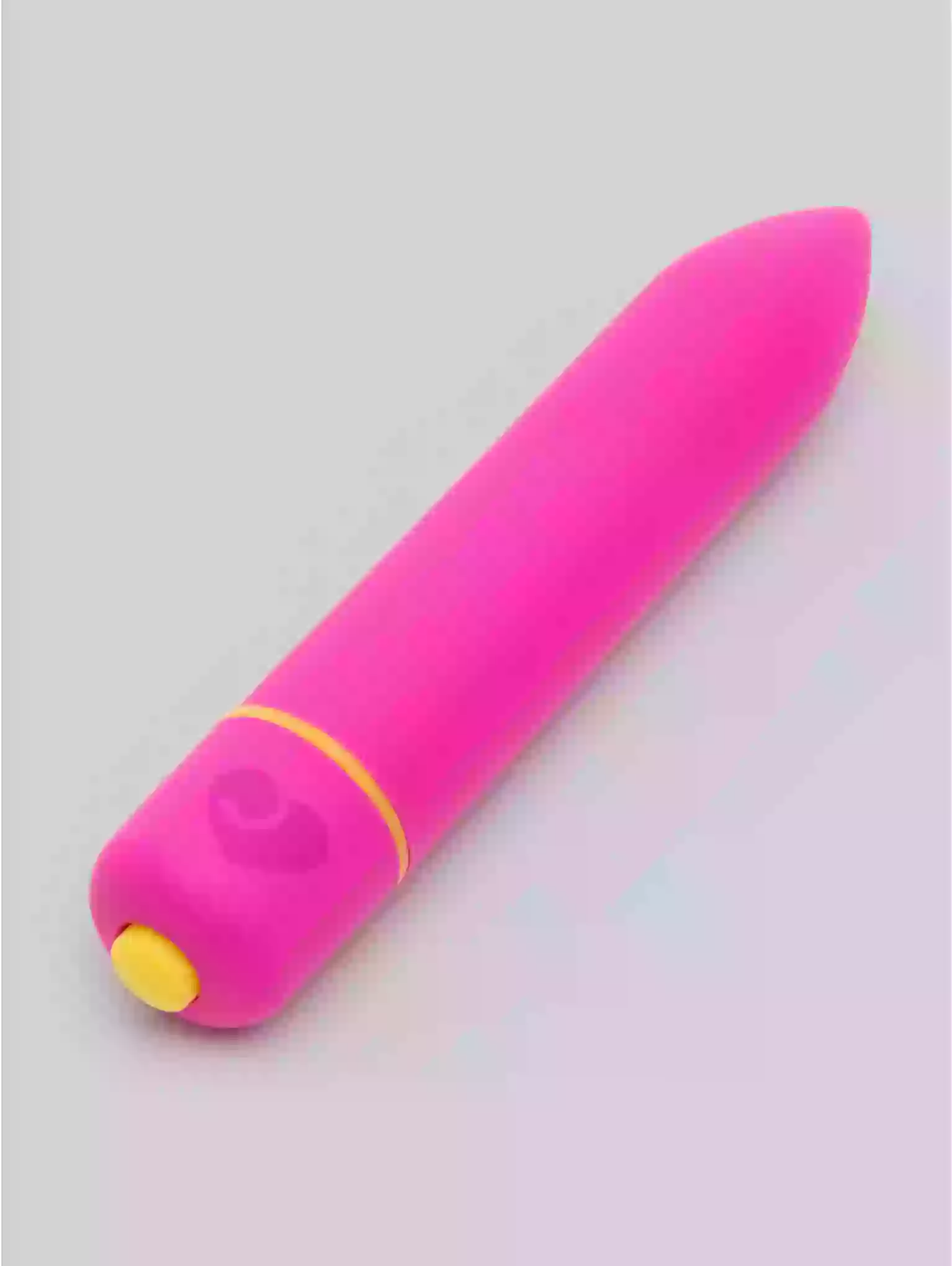 Pink and yellow object on a light gray background
