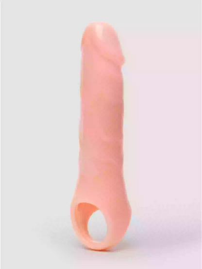 Pink silicone butt plug on a light gray background