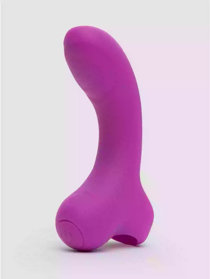 Purple silicone butt plug on a white background