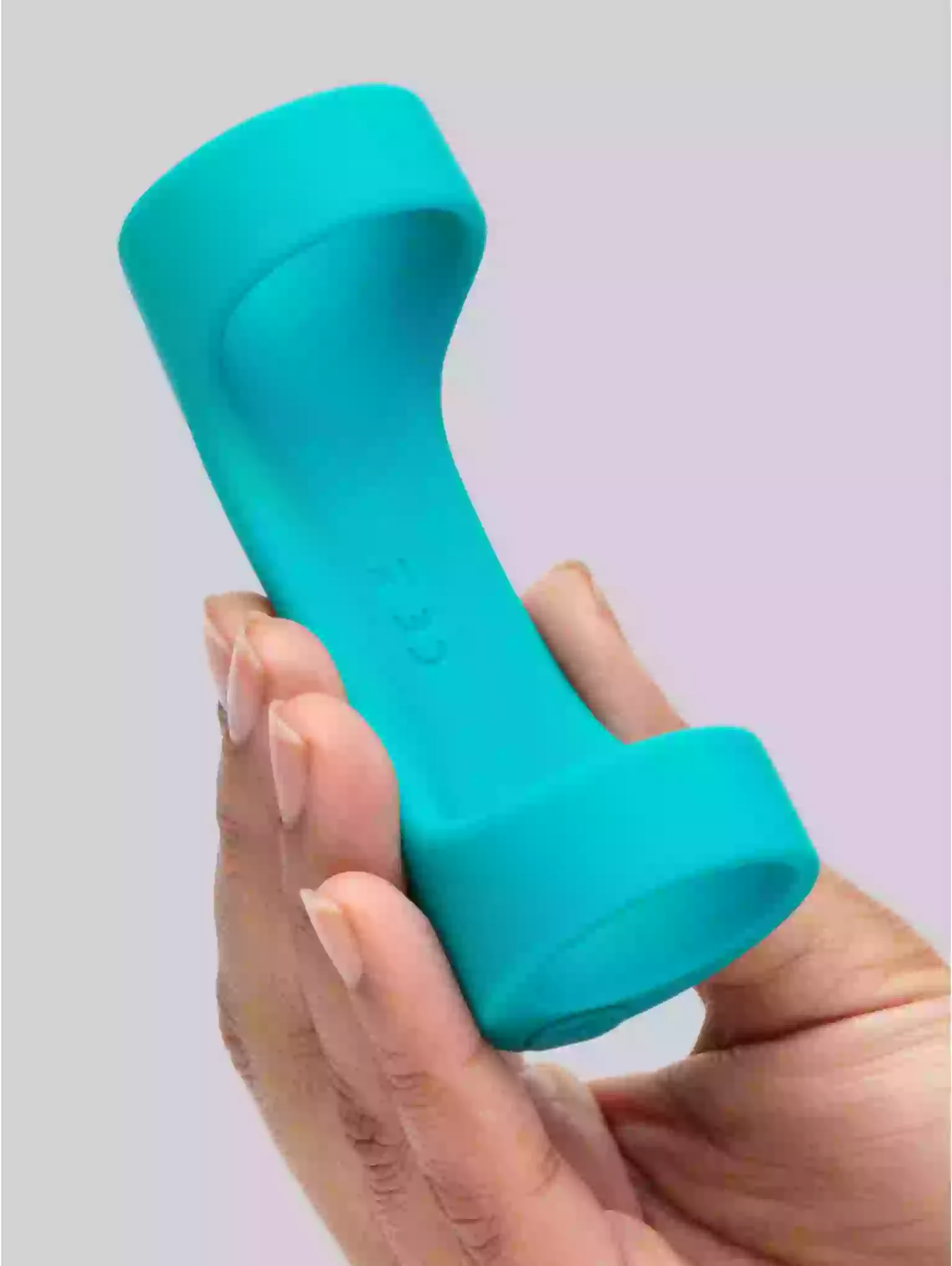 Turquoise phone receiver held in a hand against a light purple background