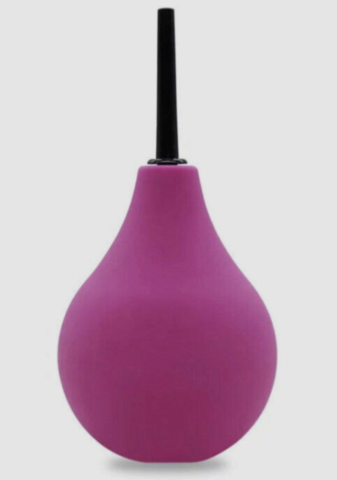 Purple bulb syringe with black top on a light gray background