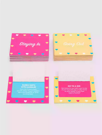 Colorful cards with text and heart designs on a light pink background