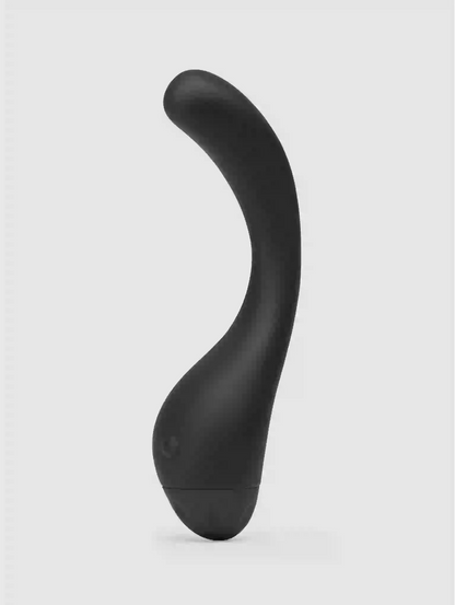 Black curved object on a light gray background