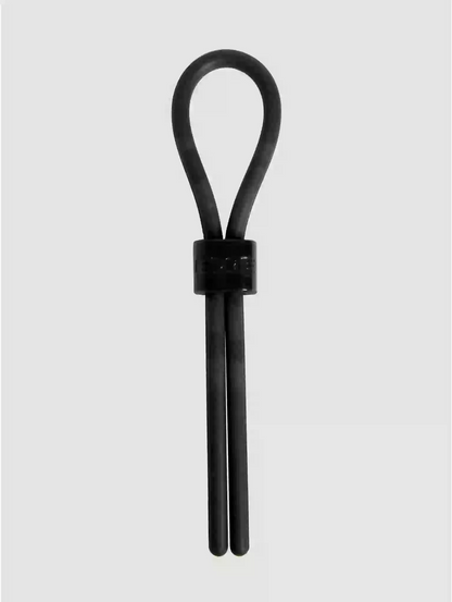 Black leather strap with a ring on a light gray background