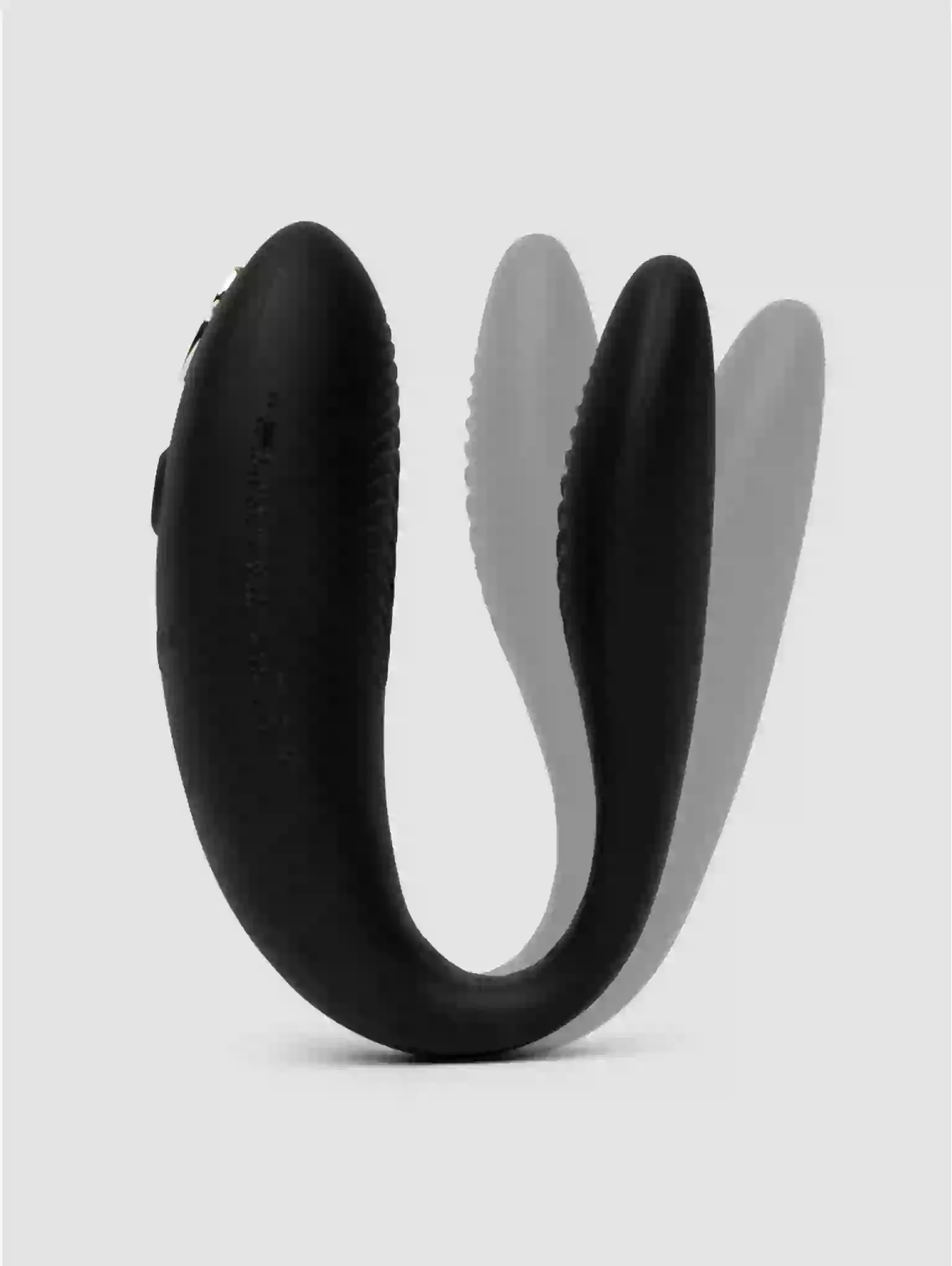 Black U-shaped object on a light gray background