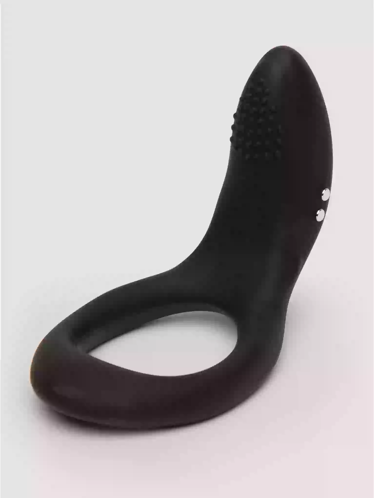 Black silicone ring with textured design on a light gray background