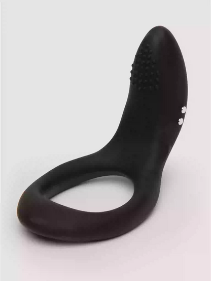 Black silicone ring with textured design on a light gray background