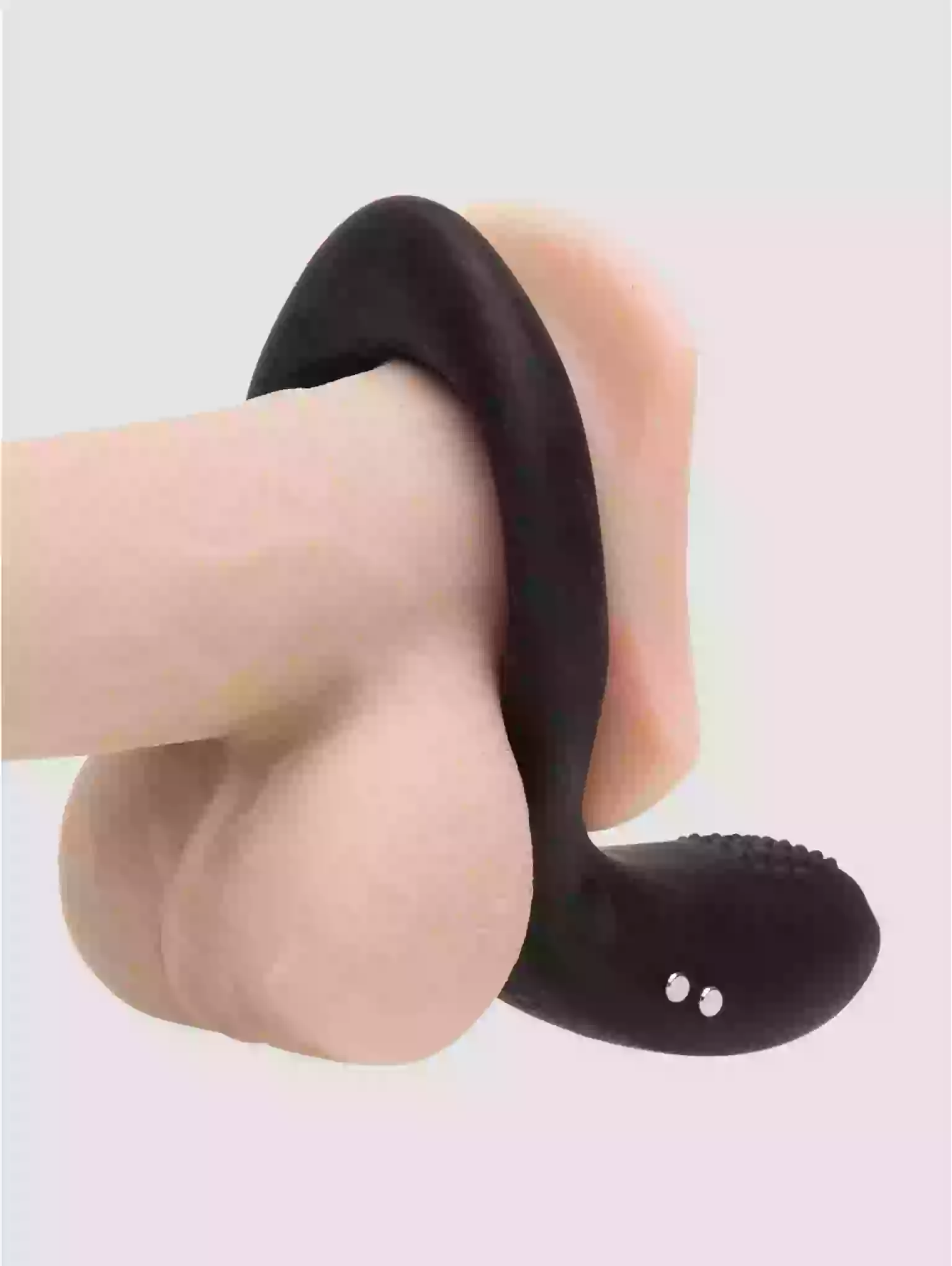 Black sandal on a foot against a light background