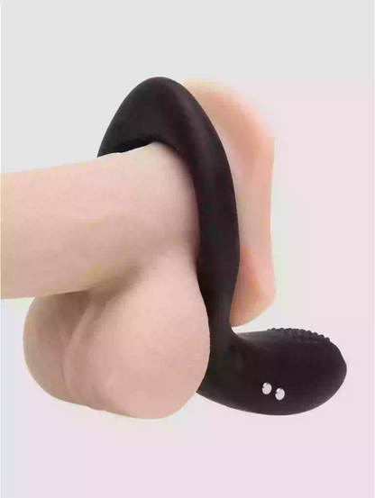 Black sandal on a foot against a light background