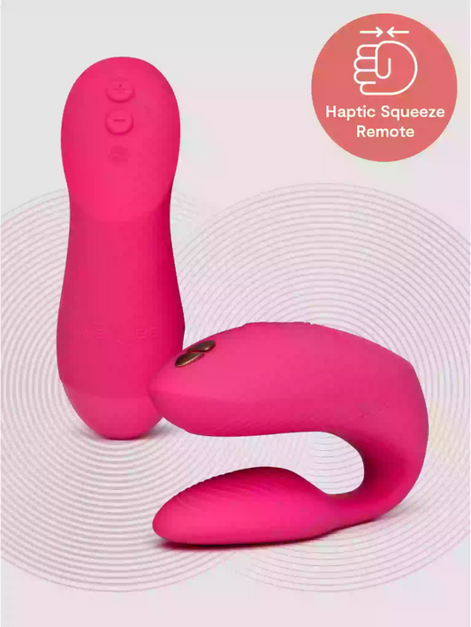 Pink haptic squeeze remote device on a light gray background