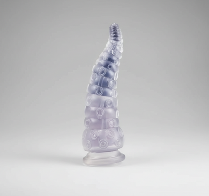 Tall, textured glass sculpture on a gray background