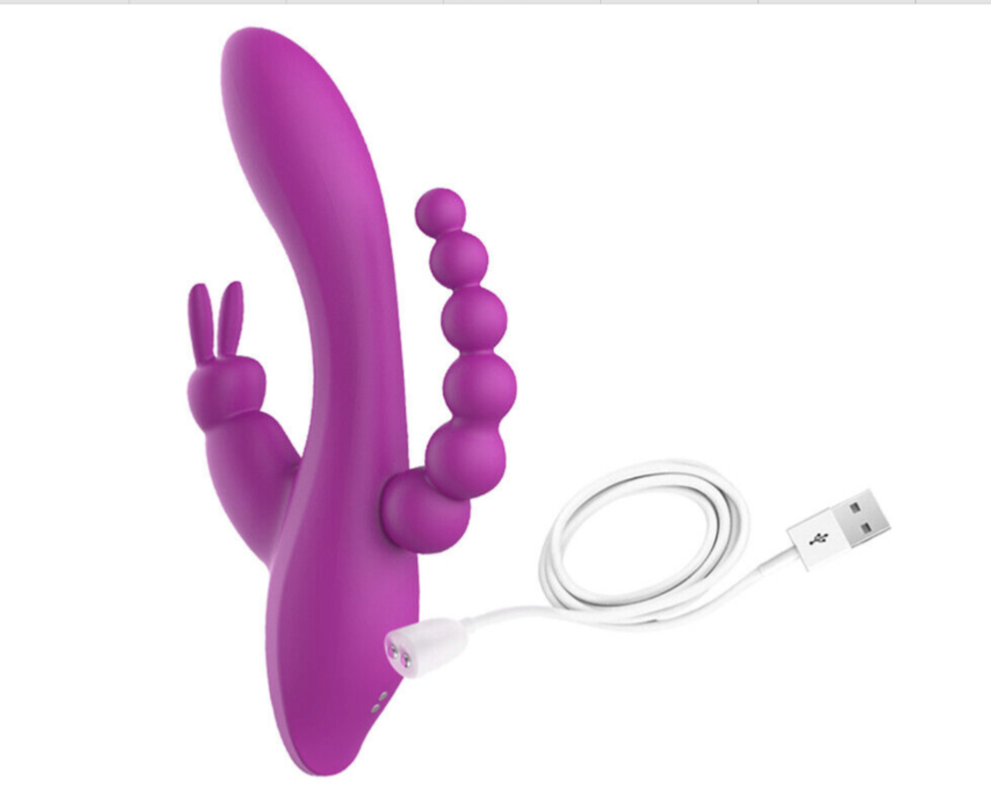 Purple electronic device with USB cable on a white background