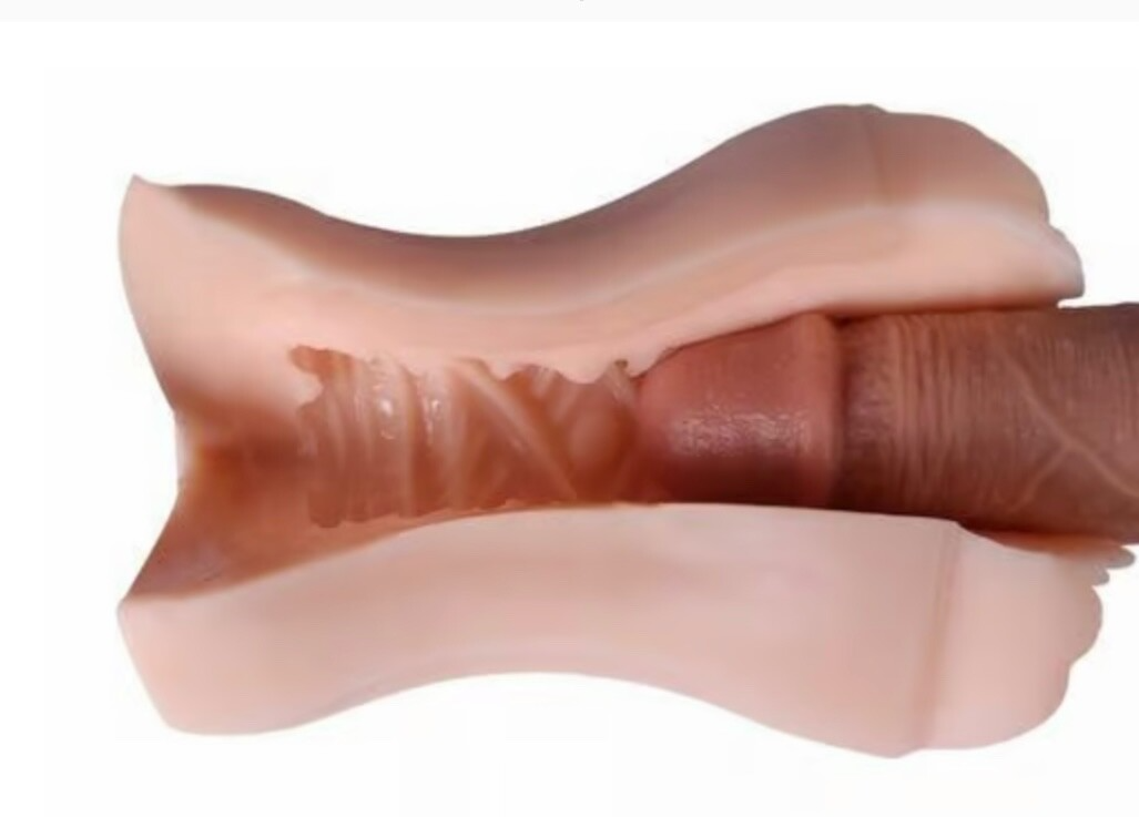 Close-up of a silicone breast implant on a white background