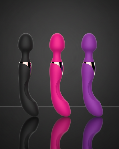 Three colorful sex toys on a reflective surface with a dark background