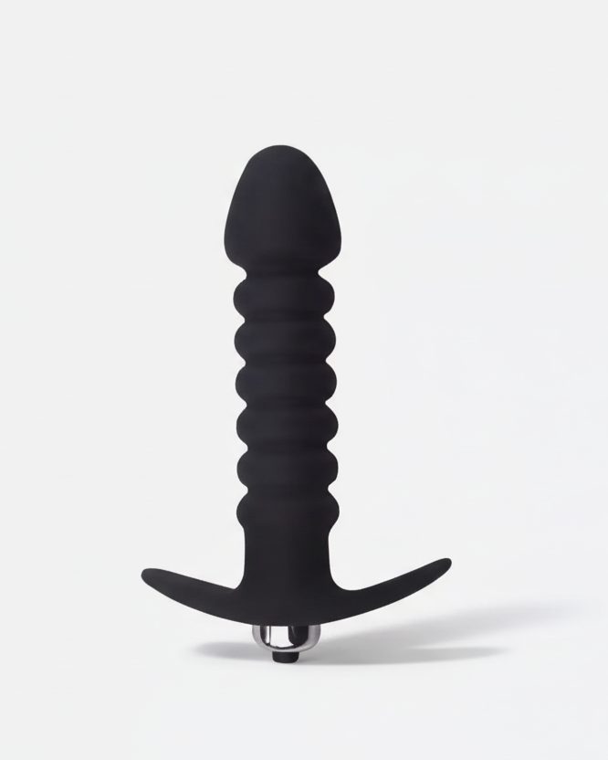 Black silicone butt plug on a white background
