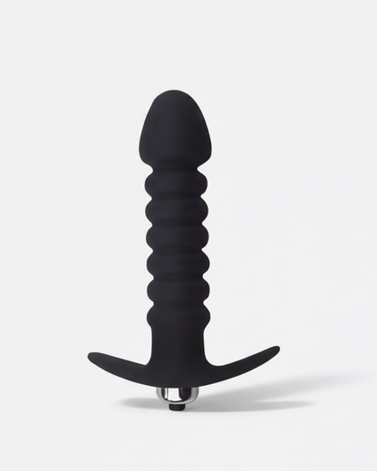 Black silicone butt plug on a white background