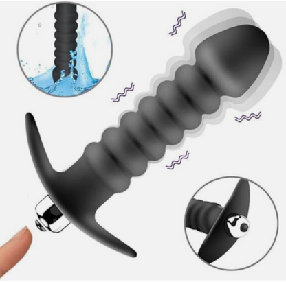 Black silicone tool with detailed design on a white background