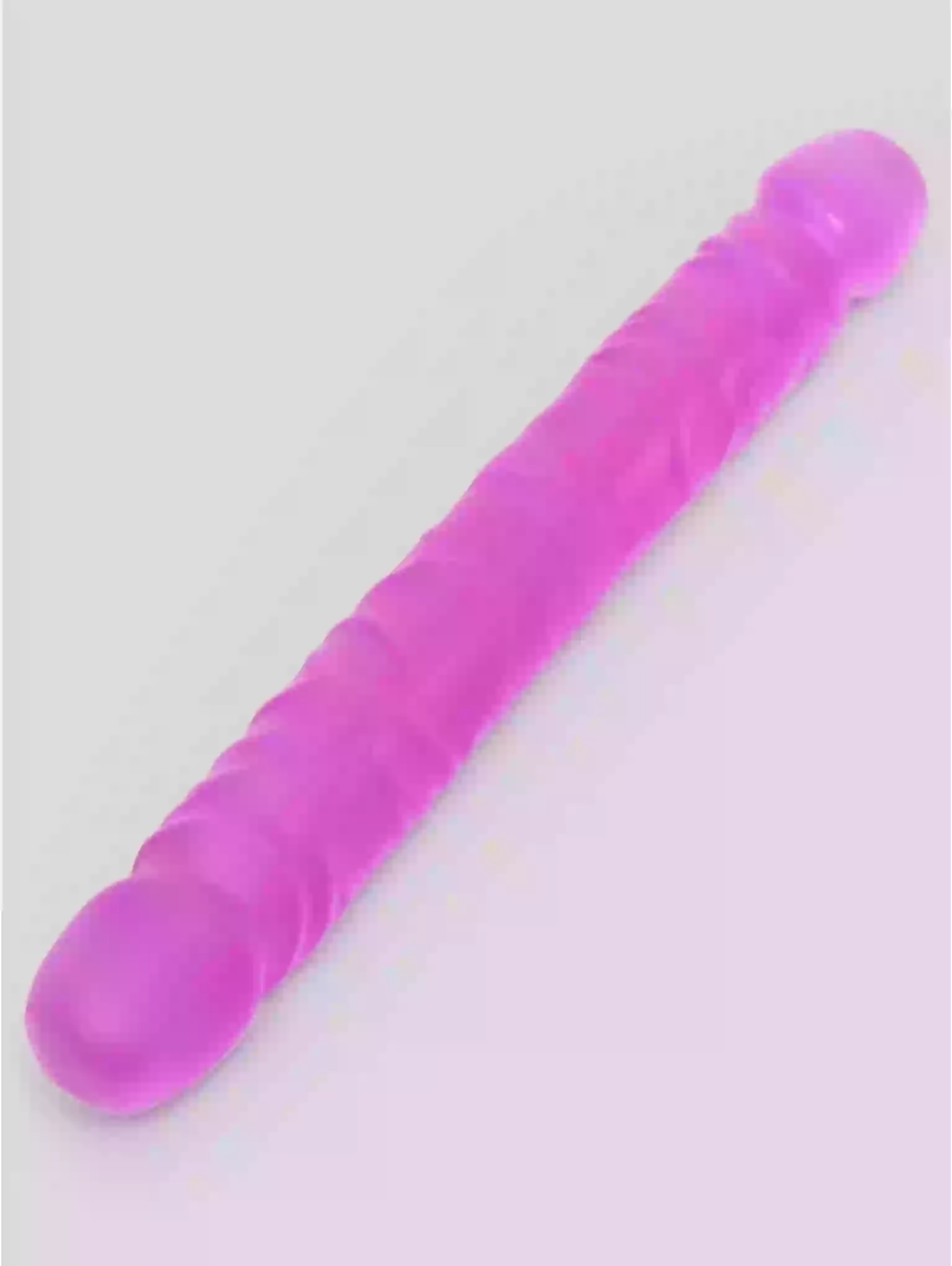 Purple cylindrical object on a light gray background