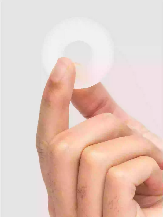 Close-up of a hand with fingers extended on a light gray background