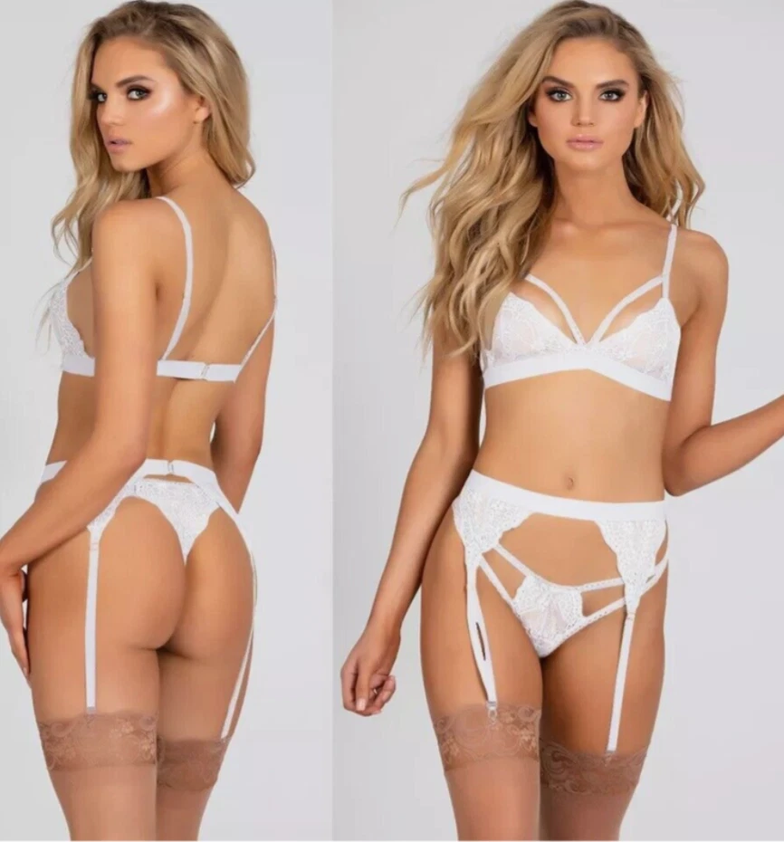 White lingerie set worn by a model on a plain background