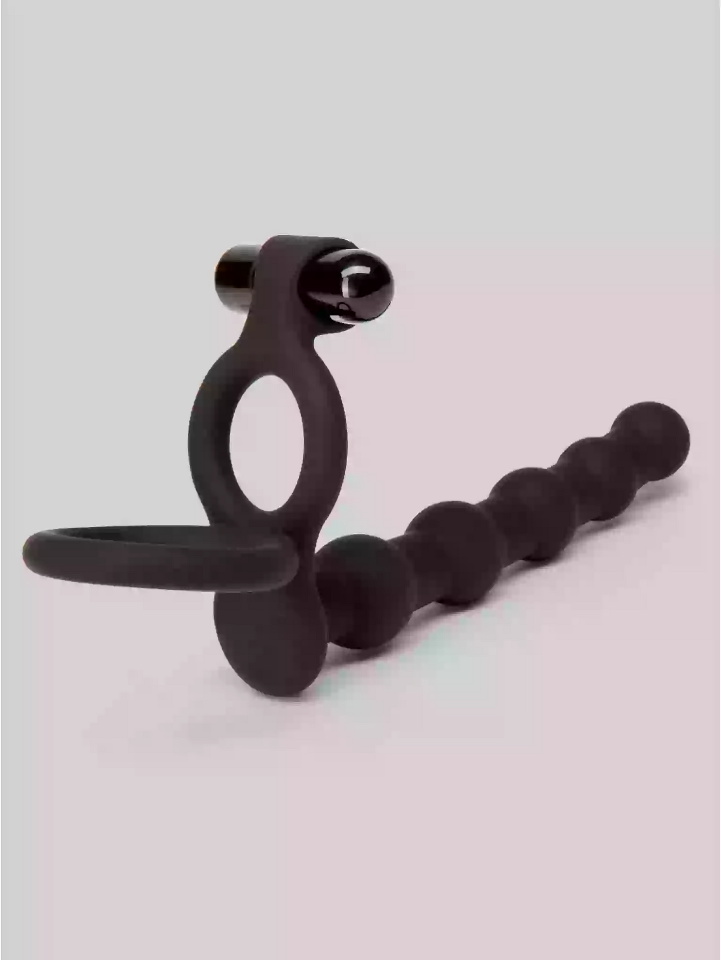 Black silicone ring with multiple loops on a light gray background