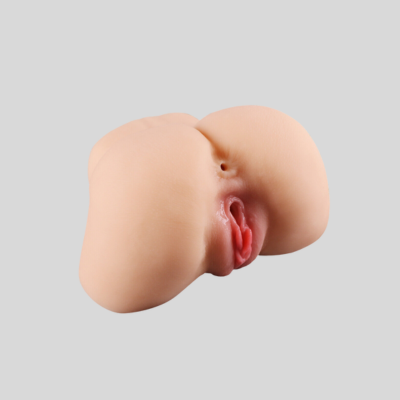 Realistic silicone breast on a gray background