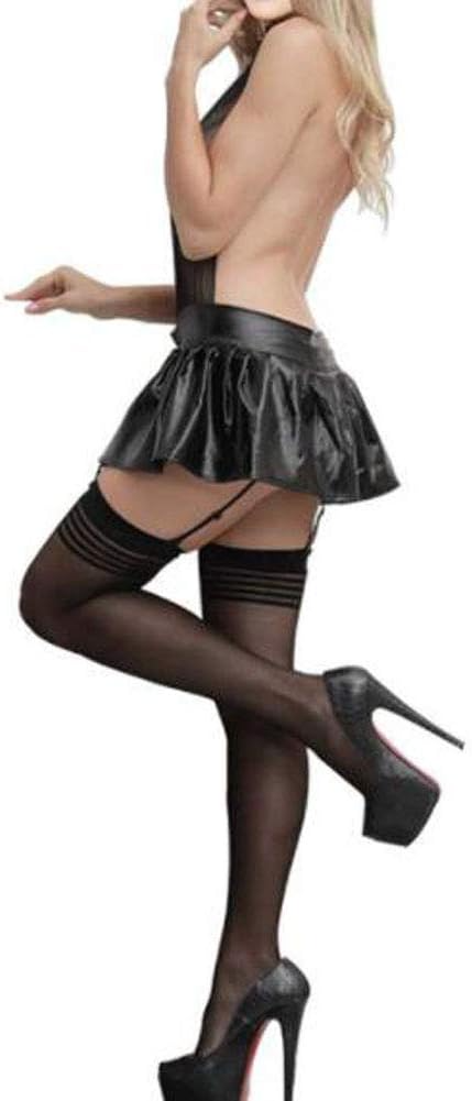 Woman wearing a black leather skirt and stockings on a white background