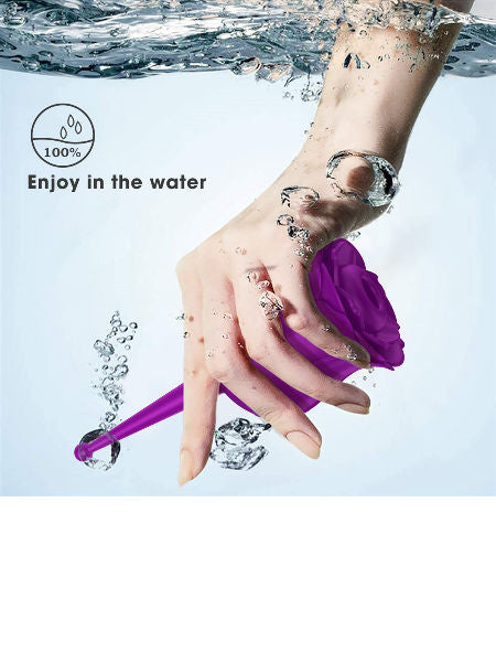 Hand holding a purple tool underwater with bubbles and water droplets.
