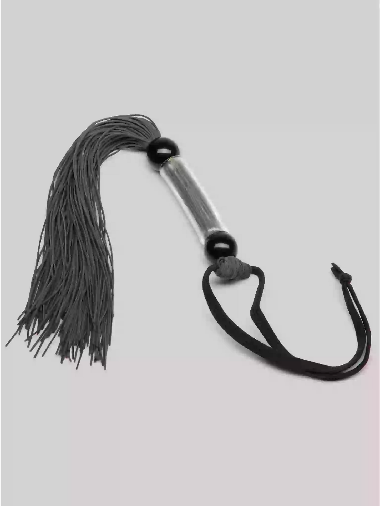 Flogger with gray tassels and black handle on a light gray background