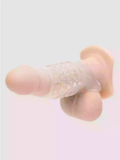 Silicone earbud with a clear gel-like material on a light pink background