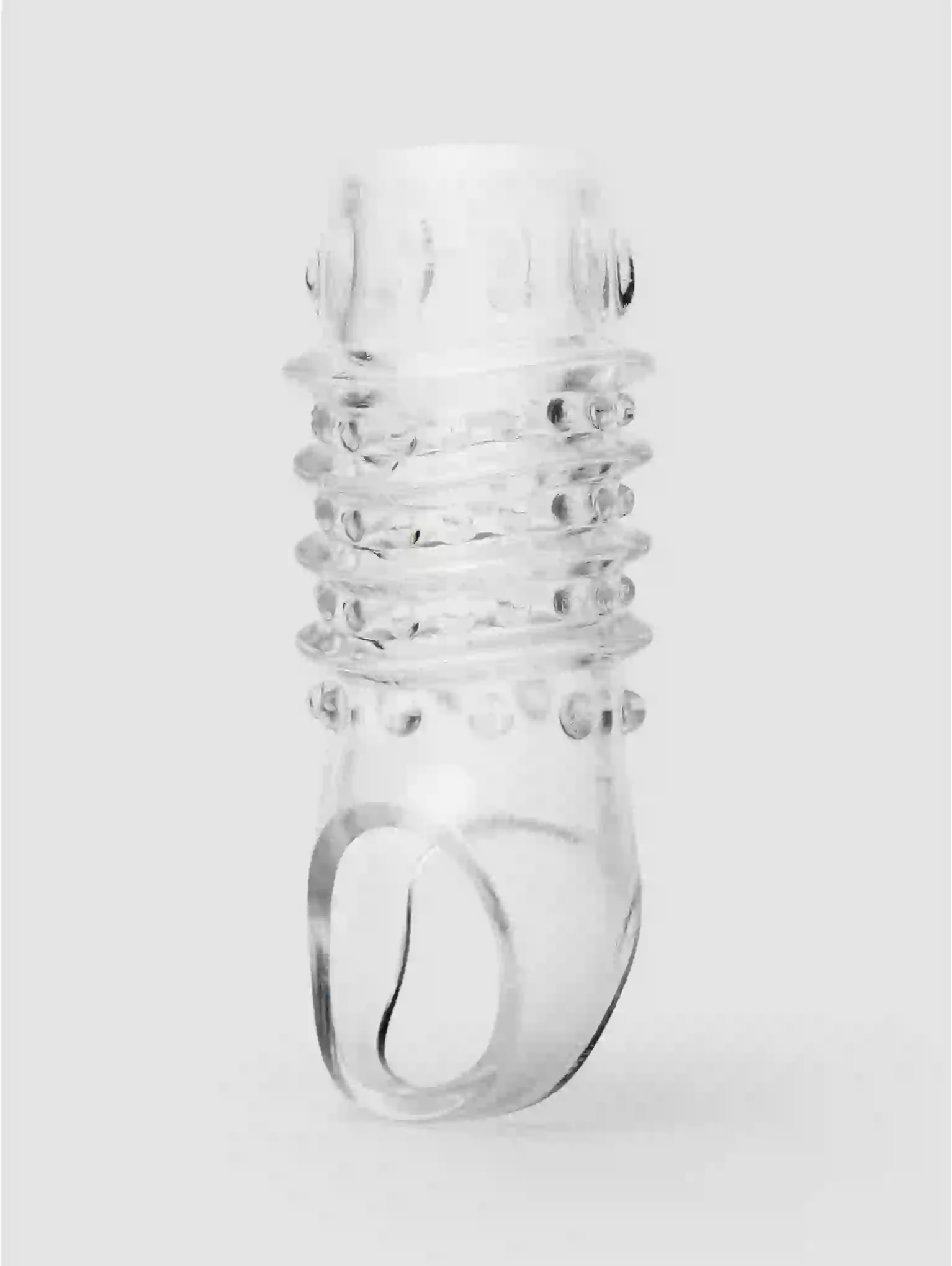 Clear glass bottle with spiral design on a white background