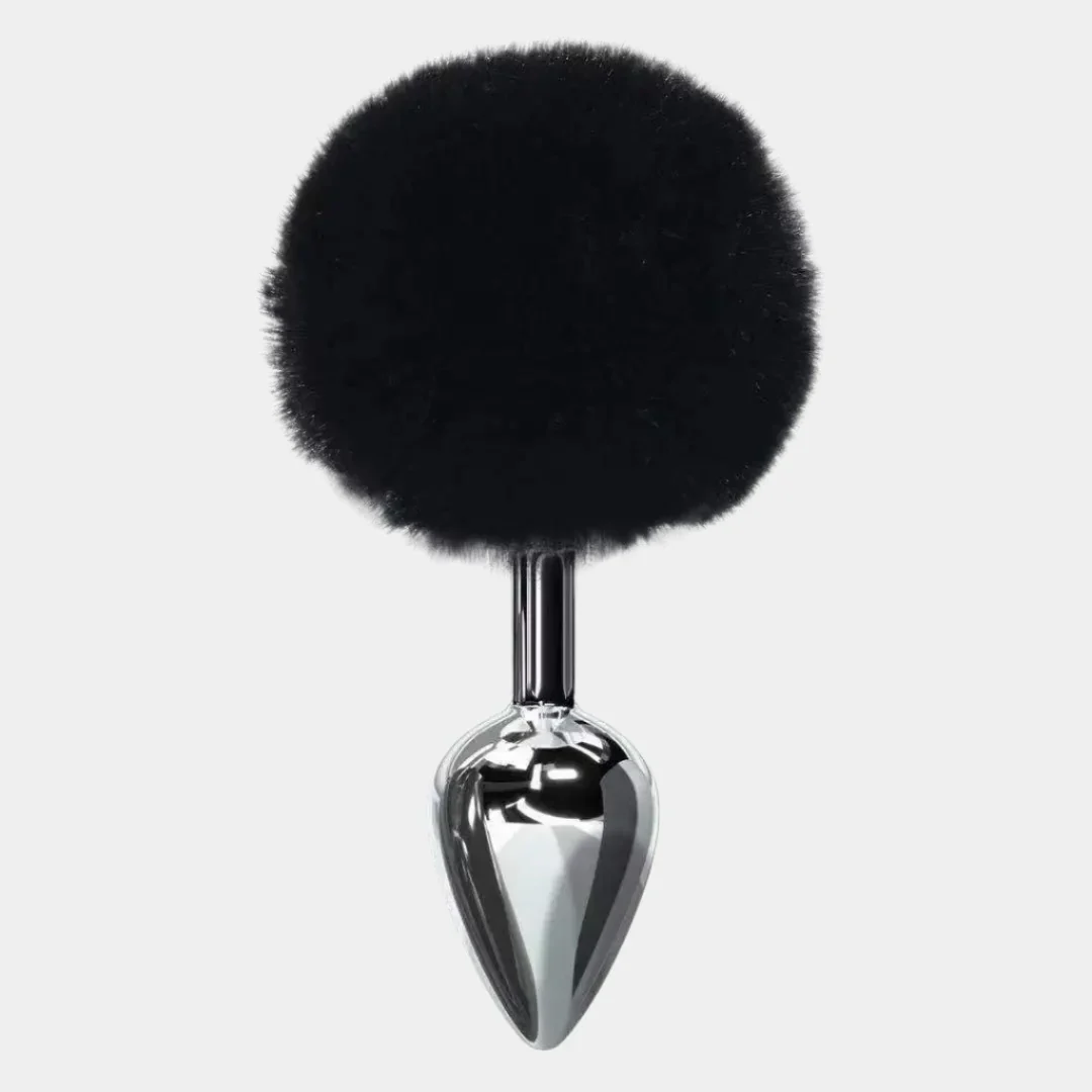 Black fur ball attached to a chrome spike on a white background