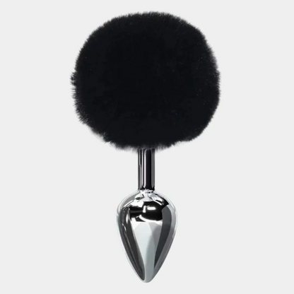 Black fur ball attached to a chrome spike on a white background