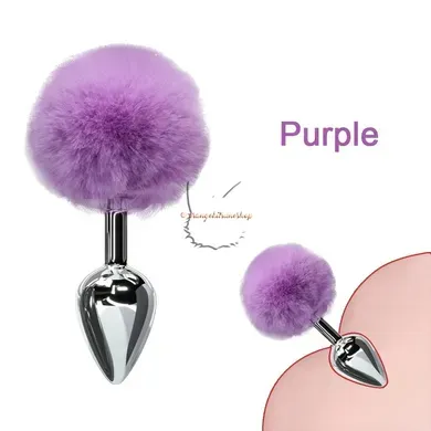 Purple fur ball with a metallic spike on a white background