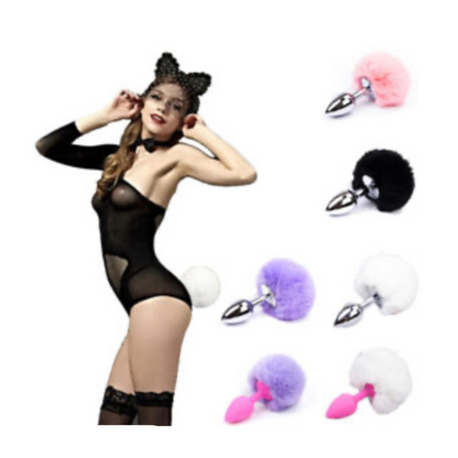 Woman in black lingerie with cat ears and a collection of colorful butt plugs on a white background.