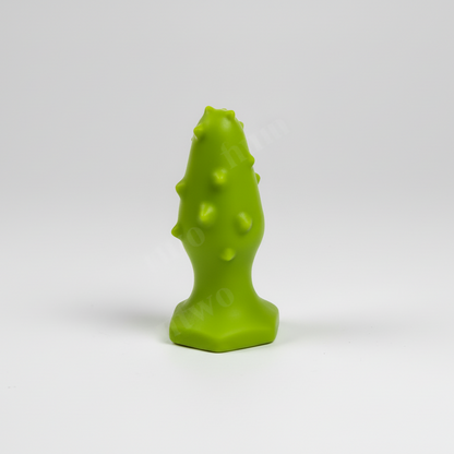 Green textured object on a white background