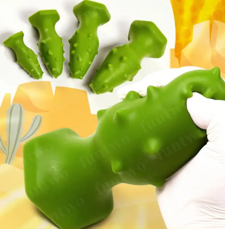 Green textured dog toy held by a gloved hand on a yellow and white background