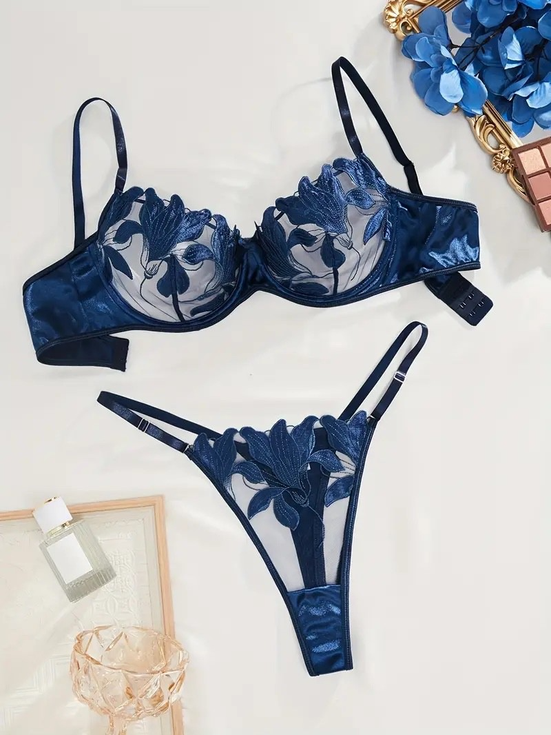 Blue floral lace lingerie set on a light background