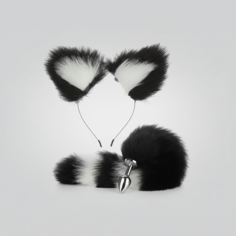 Black and white faux fur cat ears with a tail on a light gray background