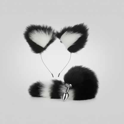 Black and white faux fur cat ears with a tail on a light gray background