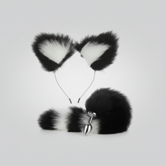Black and white faux fur cat ears with a tail on a light gray background