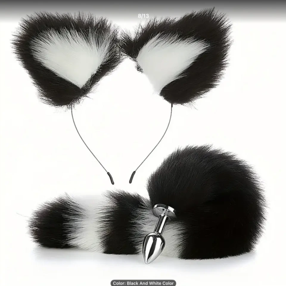 Black and white faux fur cat ears with a tail and button on a white background