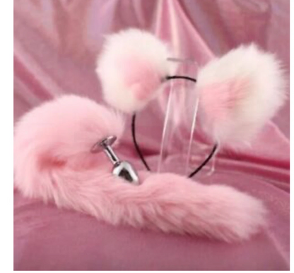 Pink furry handle with a clear grip and silver metal part on a pink background