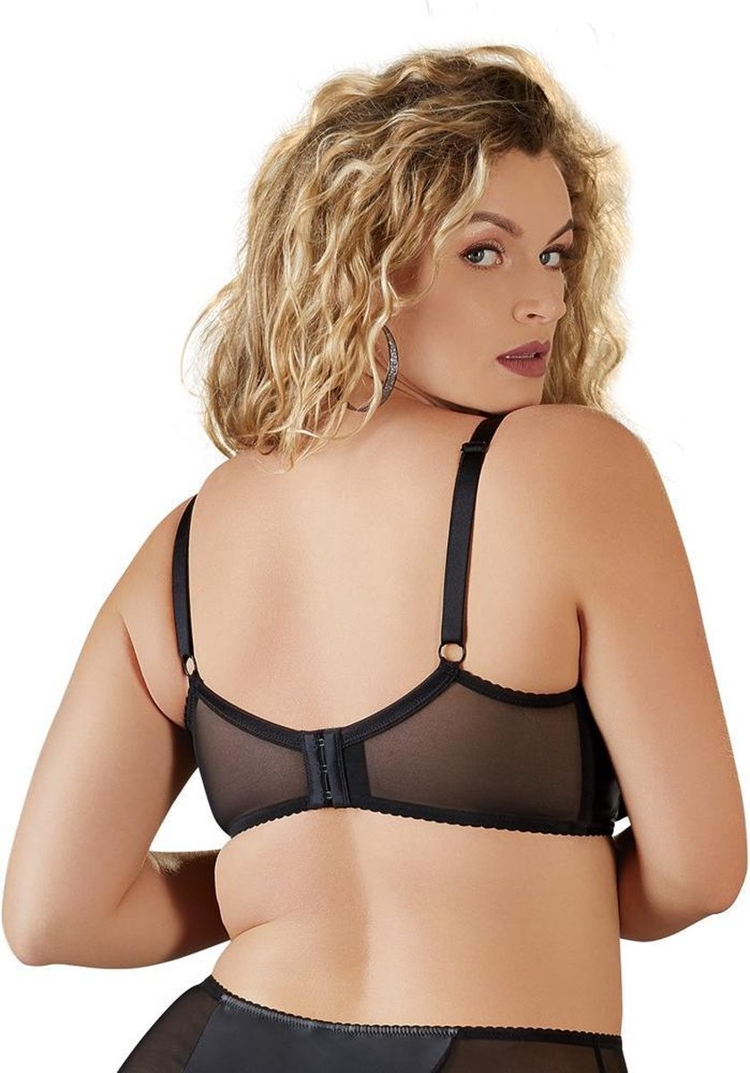 Woman wearing a black mesh lingerie set on a white background