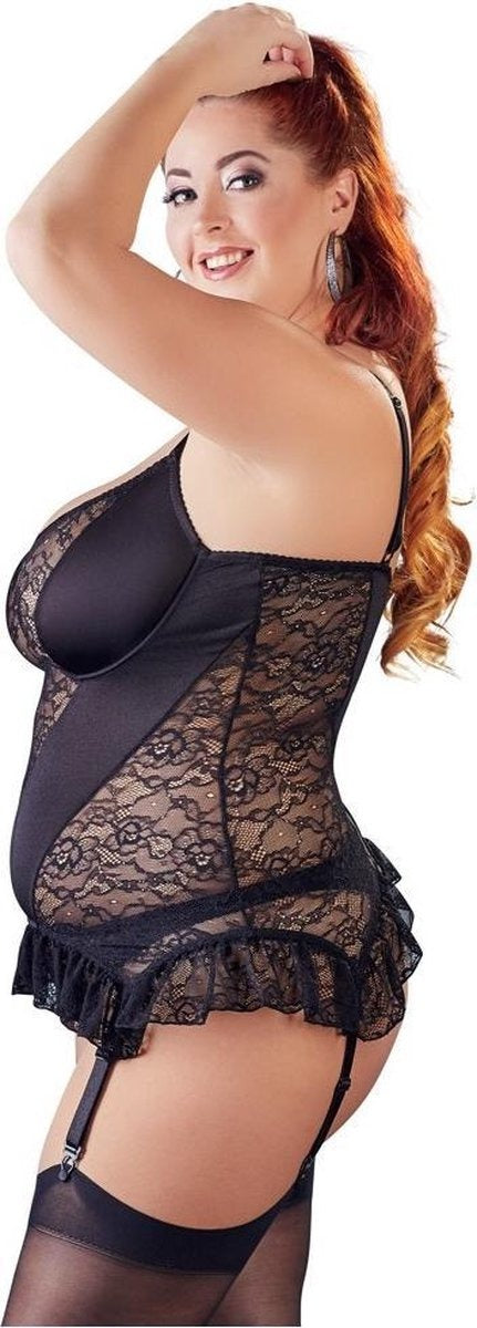 Woman wearing a black lace lingerie set on a white background