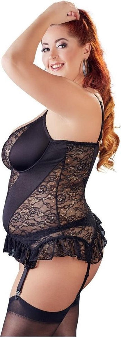 Woman wearing a black lace lingerie set on a white background